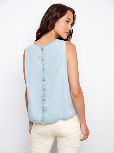 Highlighted by decorative back buttons, this sleeveless top adds a touch of elegance to your wardrobe by Charlie B.