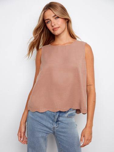 This top features a loose fit, offering comfort and style for any occasion. Perfect for pairing with jeans or skirts. By Charlie B.