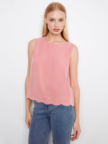 Pink sleeveless top with a loose fit, perfect for casual outings. The scallop hem adds a playful touch to this stylish piece by Charlie B.