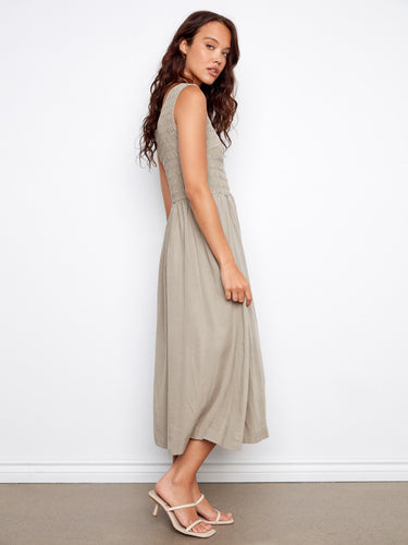 Chic dress with a scoop neckline that adds a touch of elegance to the overall design. By Charlie B.