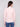 Elegant ballet pink long-sleeve sweater showcasing textured fabric and slim silhouette, styled with jeans by Charlie B.