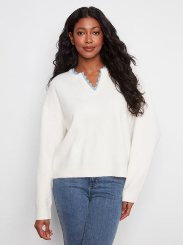 Sweater featuring a V-notch neckline with woven trim, offering a stylish touch to any casual outfit by Charlie B.