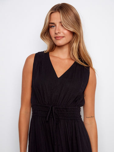 Stylish black dress with a comfortable sleeveless cut and intricate detailing, ideal for warm weather outings by Charlie B.