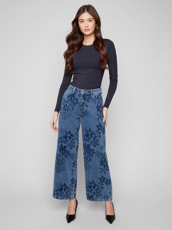 Blue wide-leg jeans featuring a long length and elegant floral jacquard design, perfect for stylish comfort by Charlie B.