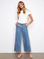Blue wide-leg jeans with scalloped edges and a flattering regular rise. Crafted from stretch denim for comfort by Charlie B.
