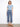 Denim jeans with a wide leg design, featuring a scalloped eyelet hem for added style. Finished by Charlie B.