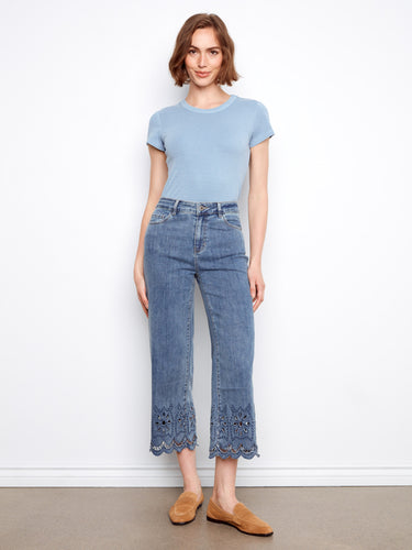 Denim jeans with a wide leg design, featuring a scalloped eyelet hem for added style. Finished by Charlie B.