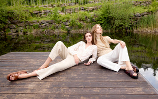 Two woman wearing white and beige cropped linen pants.