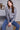 Fashionable dark heather grey sweater adorned with shimmering sequins, perfect for any occasion by Charlie B.