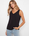 Black sleeveless bamboo cami featuring a reversible design, perfect for versatile styling by Charlie B.