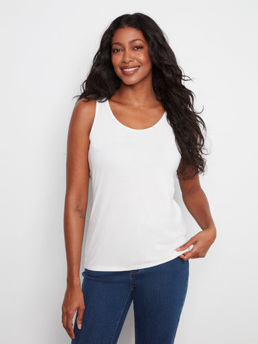 White sleeveless top featuring a scoop neckline, perfect for a casual look. The design is versatile and stylish by Charlie B.