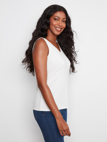 Simple yet sophisticated white tank offering a sleek silhouette and timeless appeal. Perfectly crafted by Charlie B.