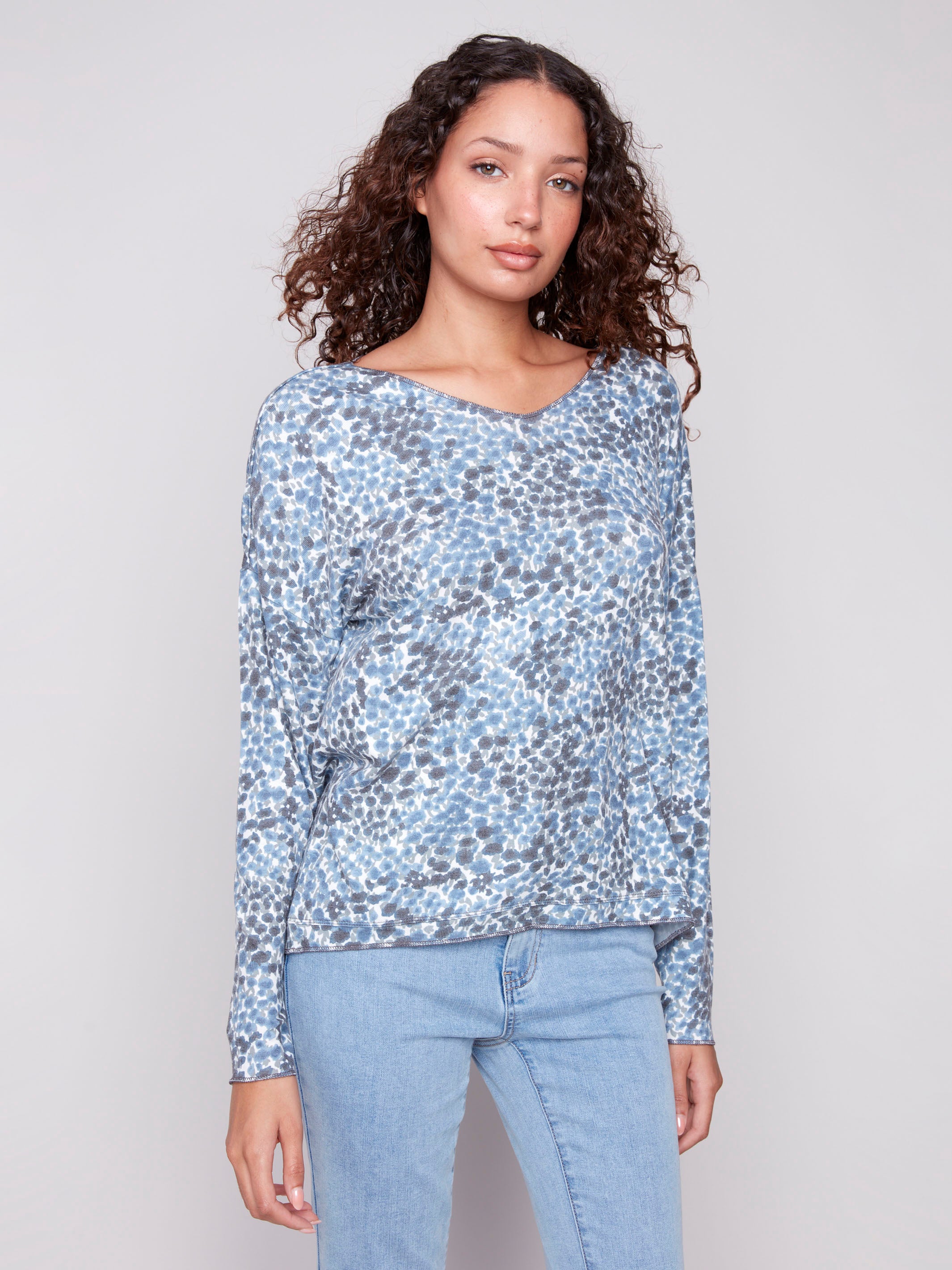 Blue knit top with relaxed fit and ditsy print, perfect for casual wear by Charlie B.