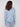 Elegant blue knit top showcasing long sleeves and a beautiful pattern design by Charlie B.