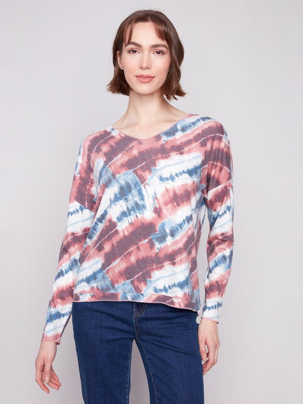 Relaxed fit pink tie-dye knit top featuring a V-neck design, perfect for casual outings by Charlie B.