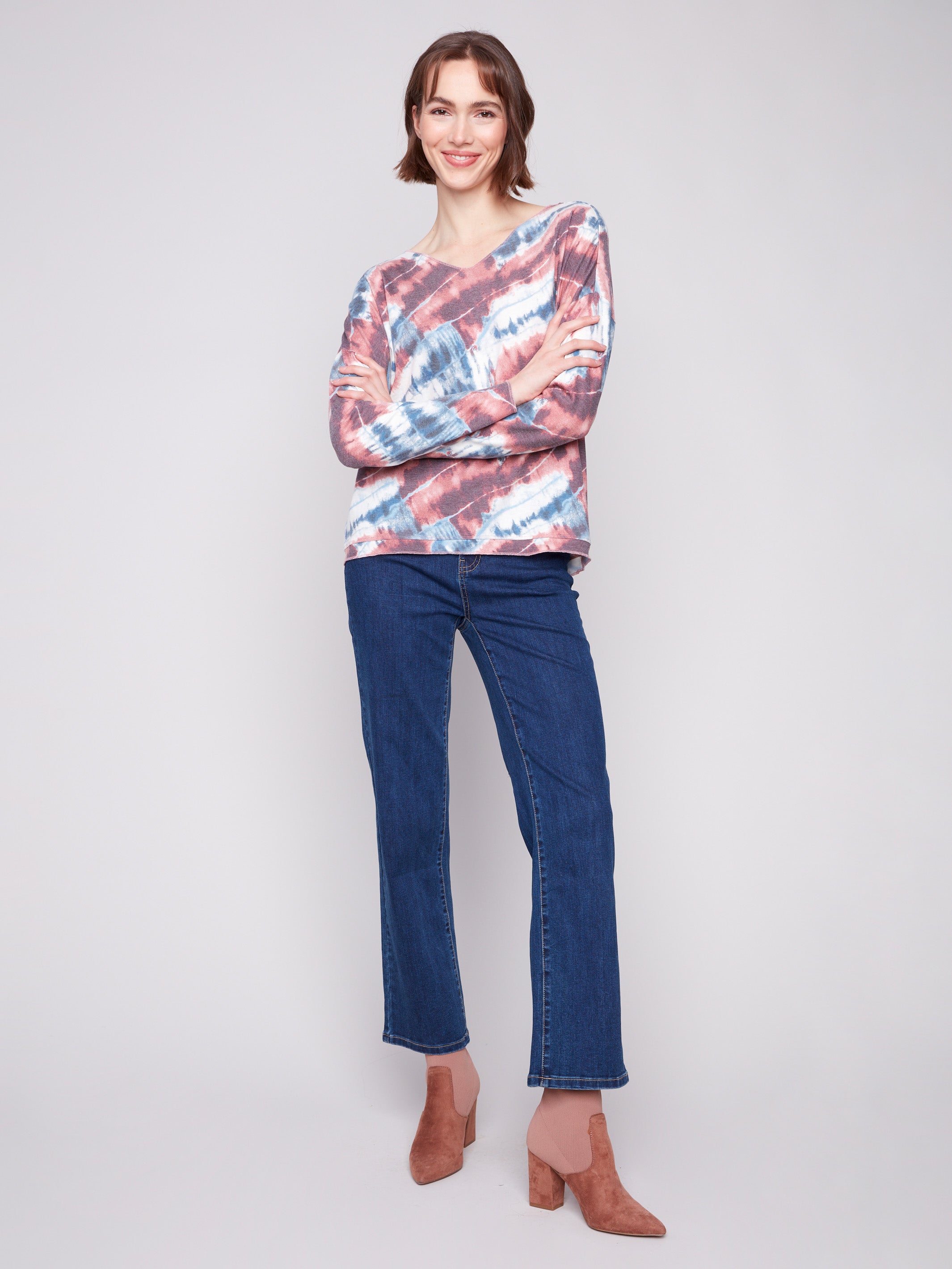 This chic relaxed fit top in a vibrant pink tie-dye is crafted with a comfy V-neck by Charlie B.