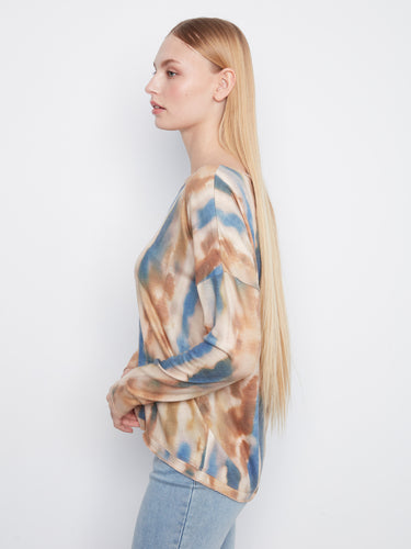 Abstract patterned knit top with long sleeves, ideal for layering on cooler days by Charlie B.