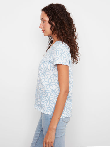 Crafted from premium cotton, this T-shirt with its elegant floral design ensures comfort and style effortlessly. By Charlie B.