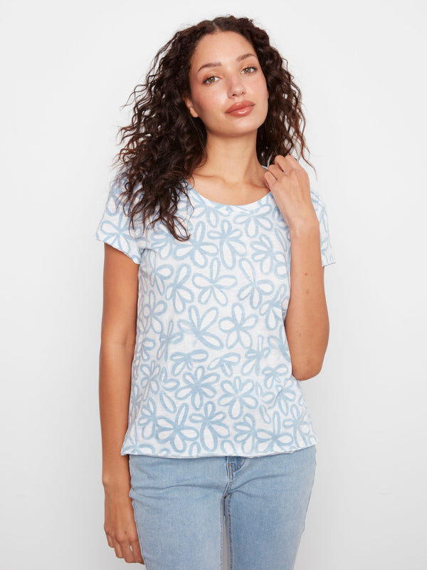 Stay stylish in this comfortable tee featuring a delicate flower pattern on soft cotton material for all-day wearability by Charlie B.