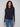 Black long-sleeve top with a crew neck, featuring a sleek fit and super stretchy fabric by Charlie B.