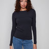 Black long-sleeve top with a crew neck, featuring a sleek fit and super stretchy fabric by Charlie B.