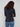Black long-sleeve top with a crew neck, featuring a sleek fit and super stretchy fabric by Charlie B.