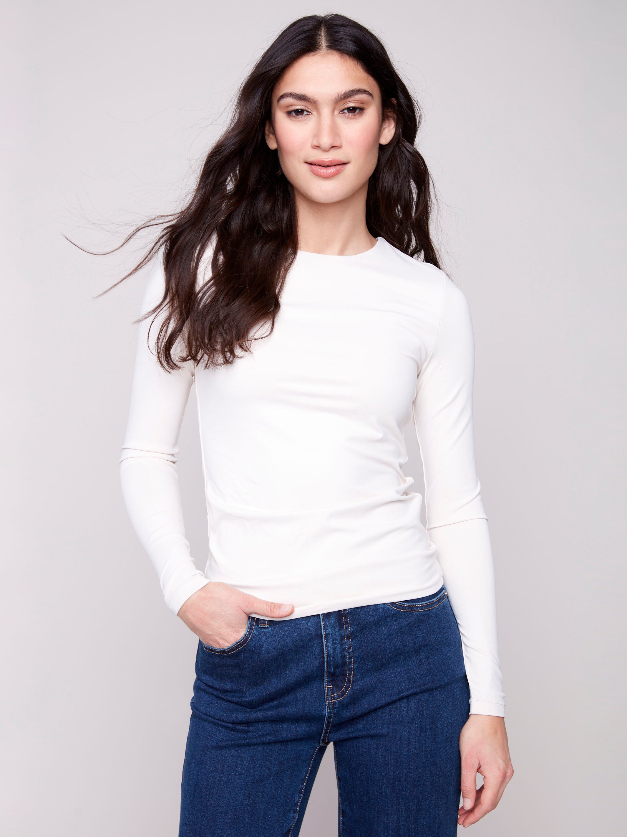 Natural long-sleeve top with a crew neck, featuring a sleek fit and super stretchy fabric by Charlie B.