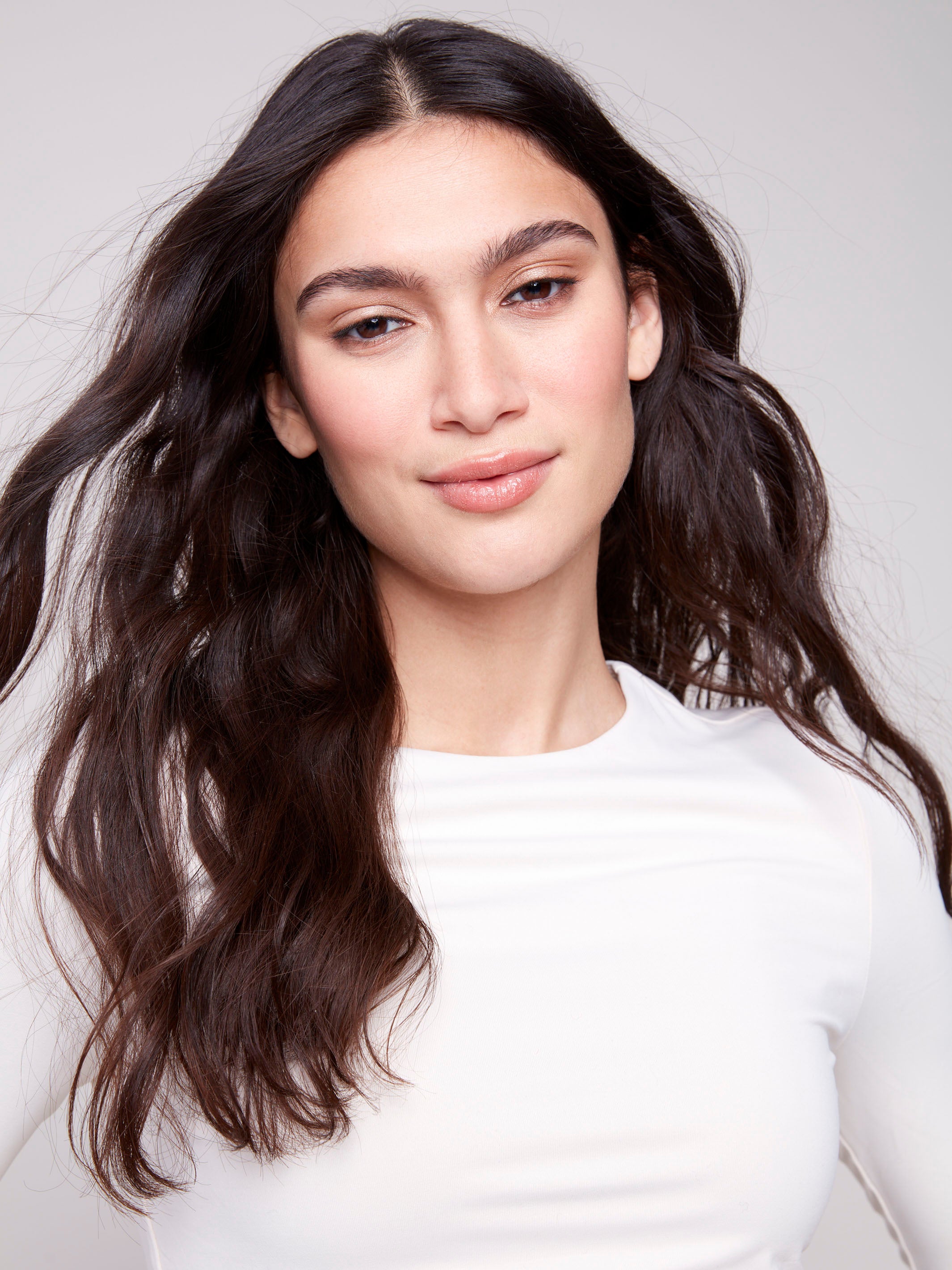Natural long-sleeve top with a crew neck, featuring a sleek fit and super stretchy fabric by Charlie B.