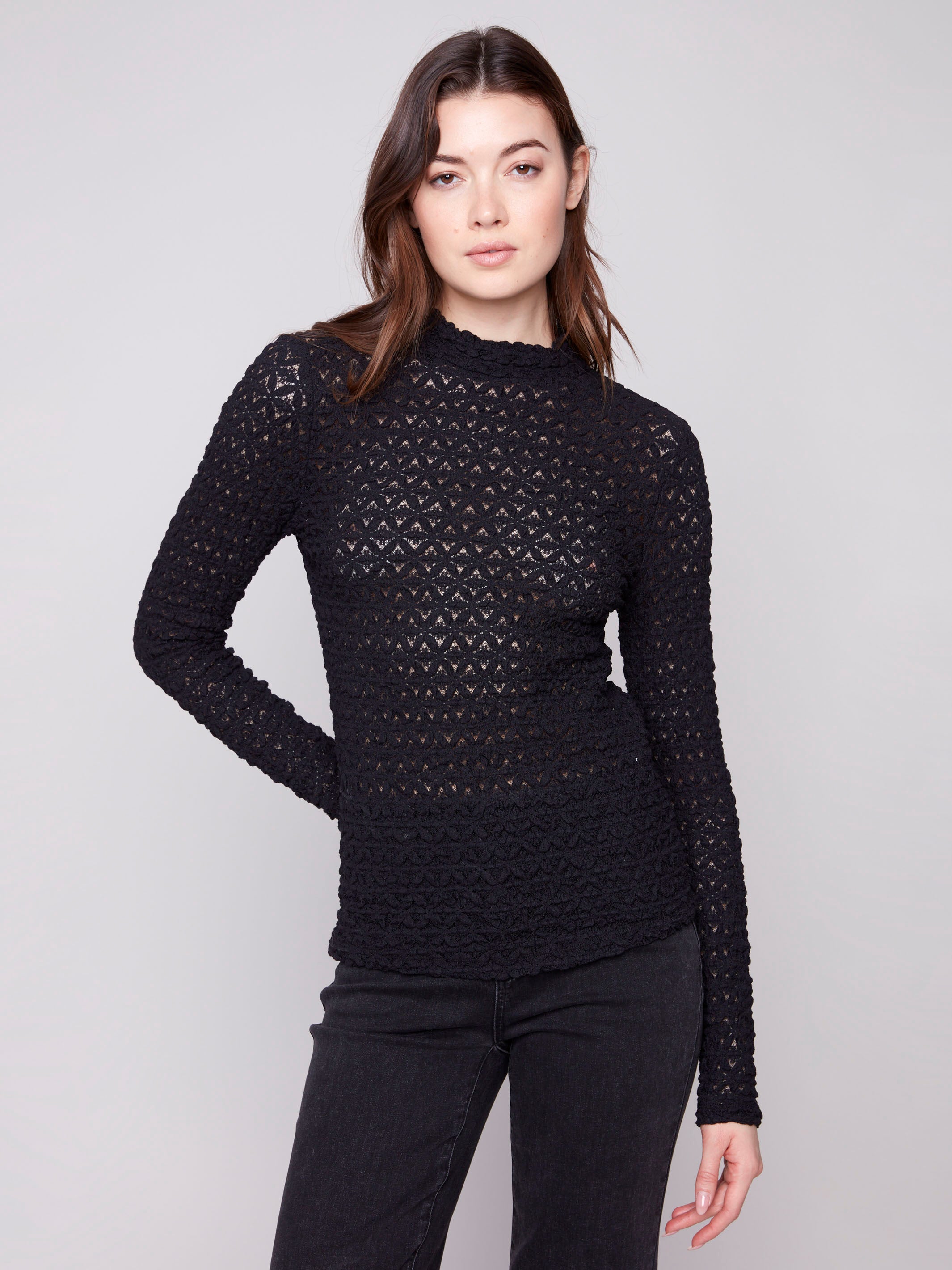 Elegant black top with long sleeves and a fitted silhouette, perfect for a chic look by Charlie B.