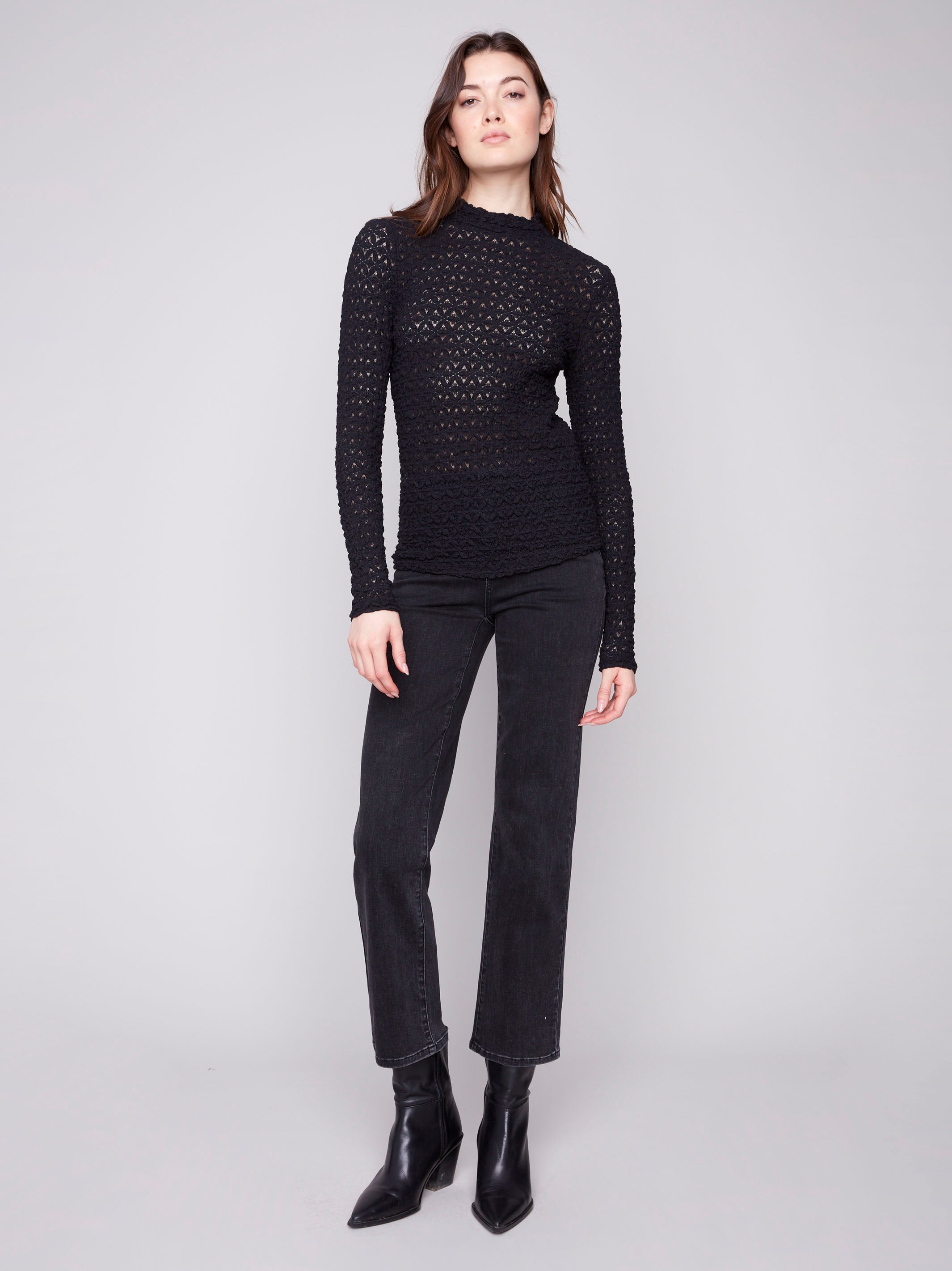 Stylish top featuring a semi-sheer design and intricate lace pattern, ideal for any occasion by Charlie B.