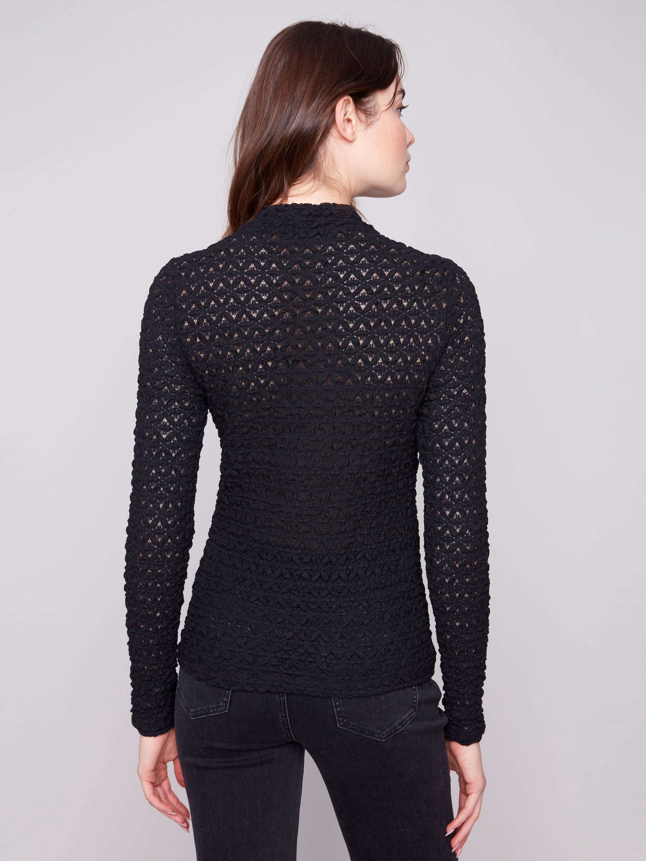 Sophisticated fitted silhouette with intricate lace detailing offers timeless elegance by Charlie B.