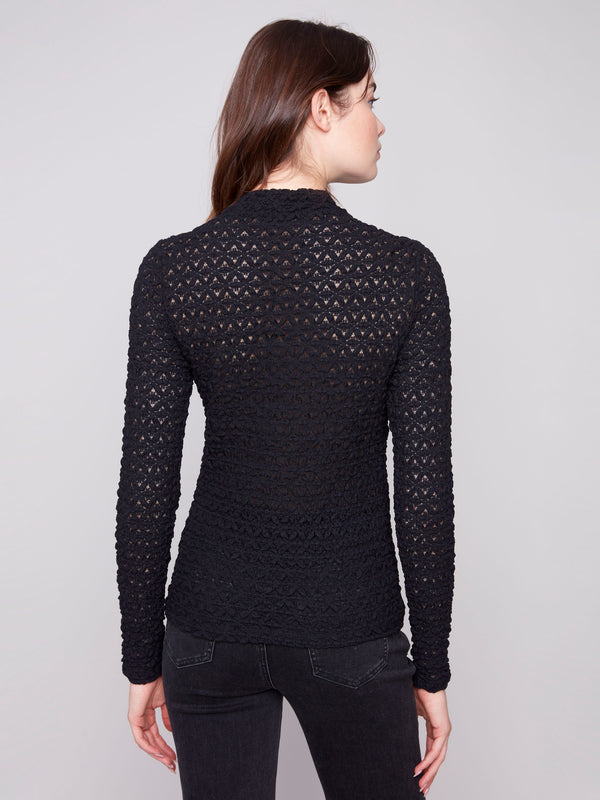 Sophisticated fitted silhouette with intricate lace detailing offers timeless elegance by Charlie B.