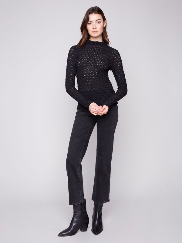Beautifully crafted semi-sheer black top, designed with attention to detail and style in mind by Charlie B.
