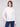 Ecru lace top featuring long sleeves and a fitted silhouette, ideal for elegant layering by Charlie B.