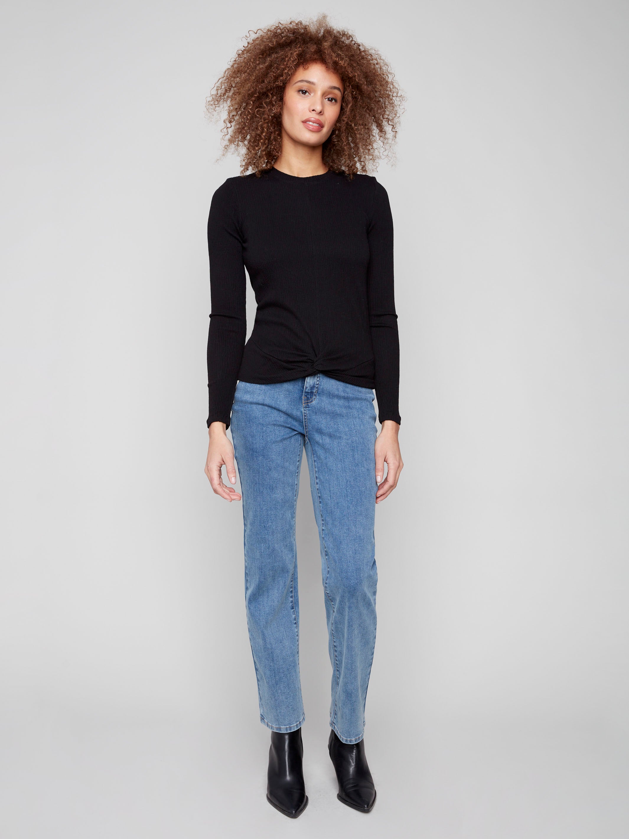 Black long sleeve textured knit top with a front knot by Charlie B.