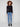 Black long sleeve textured knit top with a front knot by Charlie B.