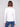 Ecru long sleeve textured knit top with a front knot by Charlie B.