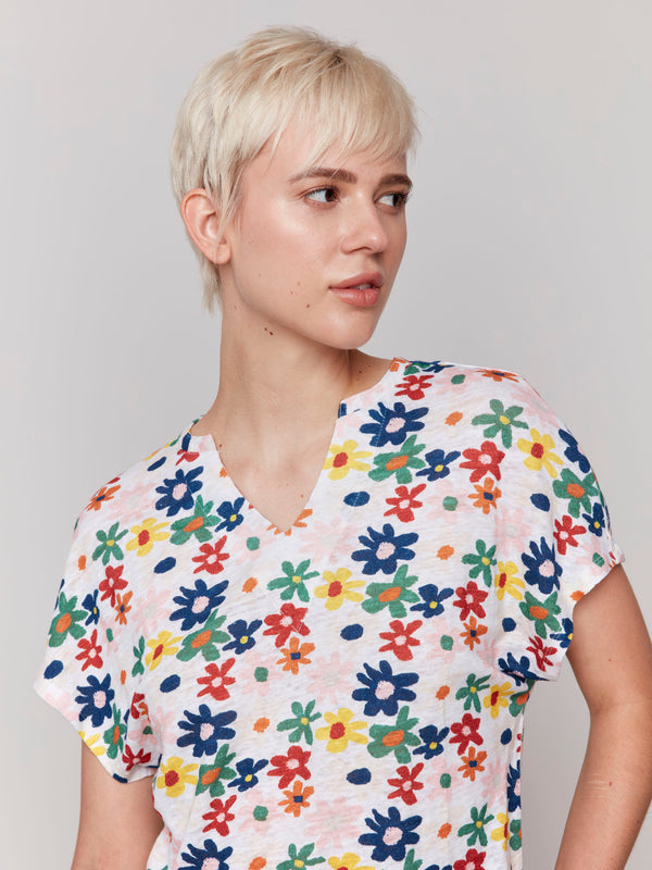 Daisy print top featuring a stylish split neck by Charlie B.