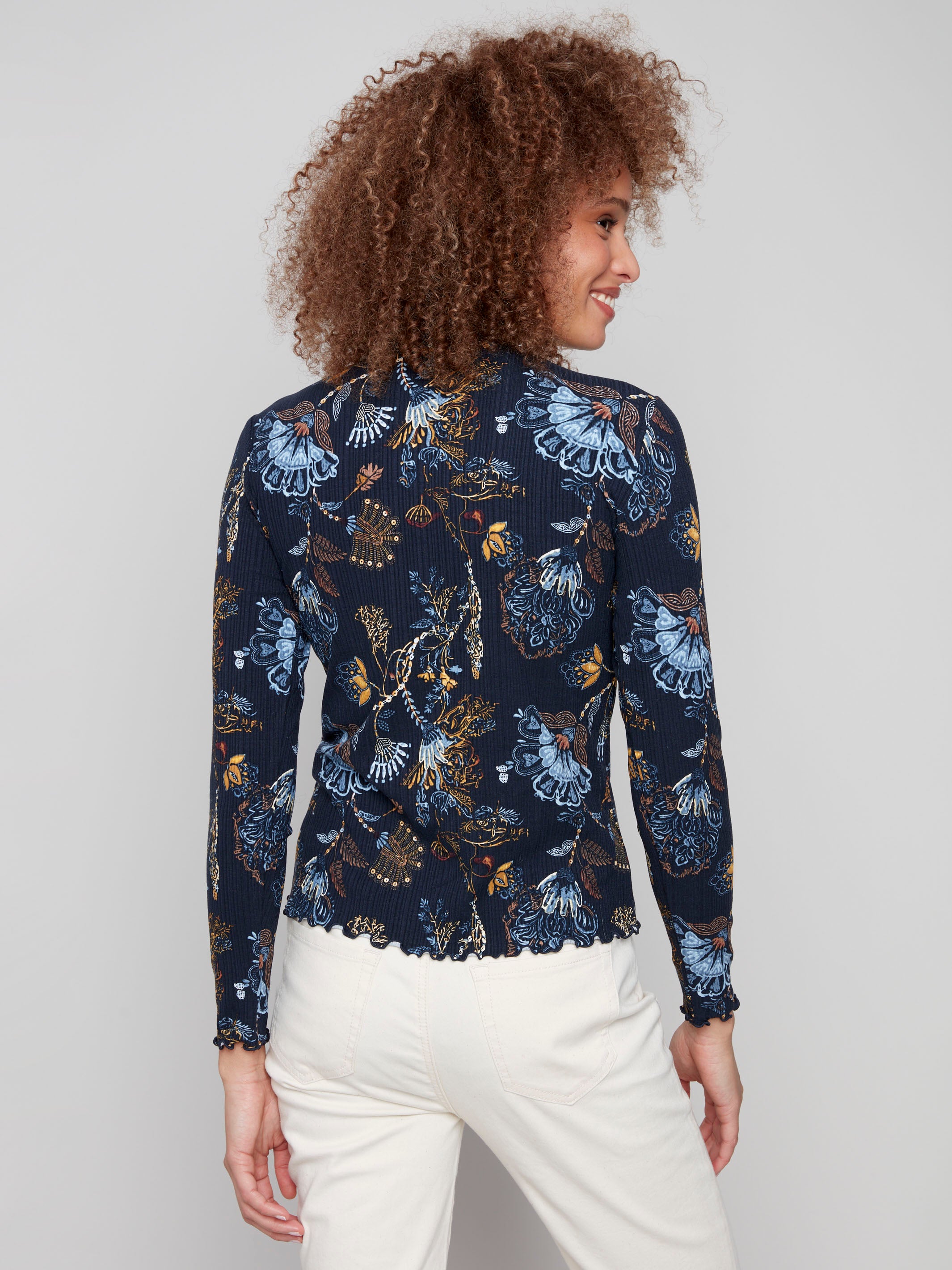 Elegant floral pattern on this mock neck top enhances its slim fit silhouette and stylish appeal by Charlie B.