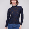 Blue black top featuring a slim fit and long sleeves, perfect for layering or wearing solo by Charlie B.