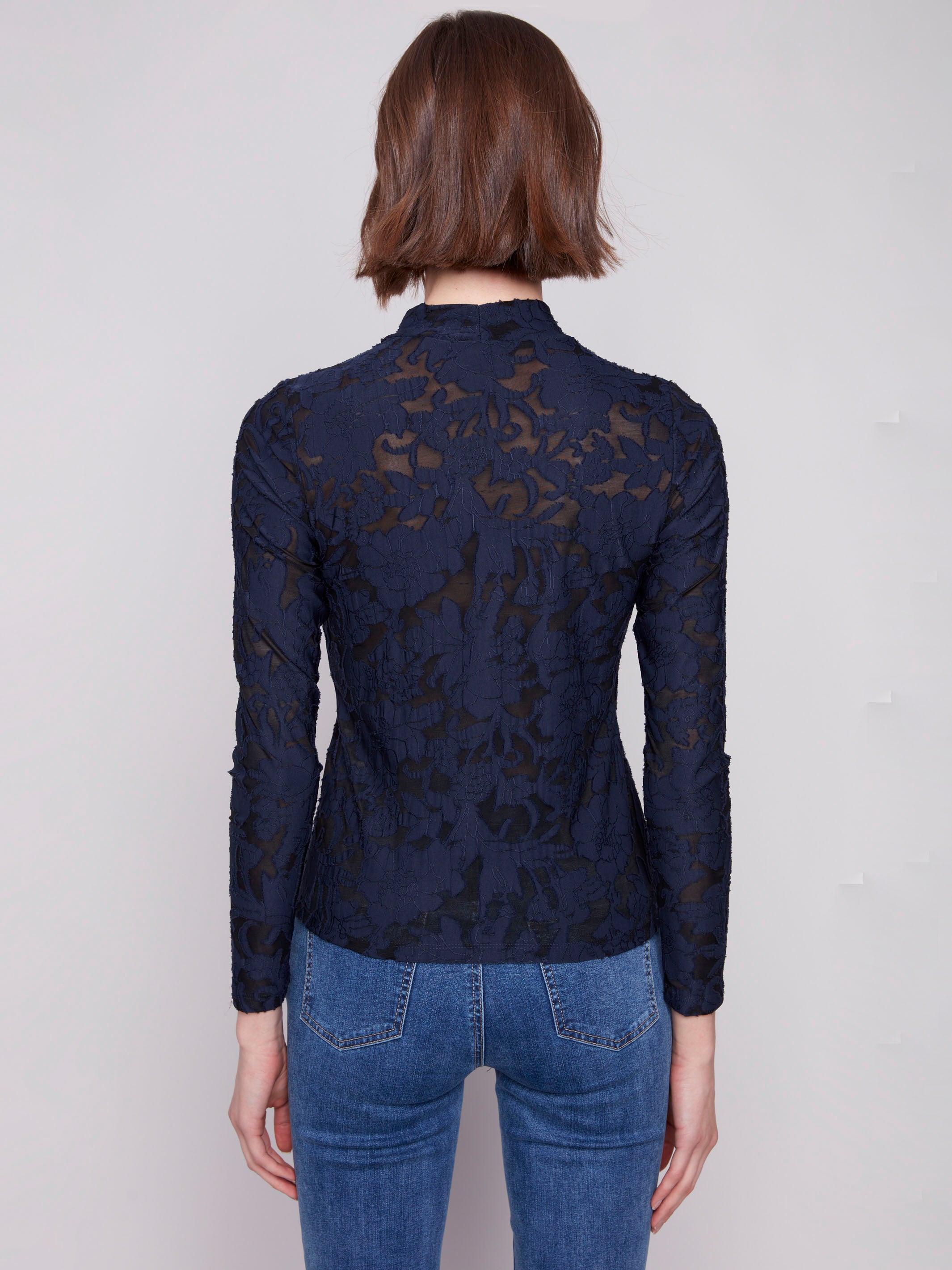 Elegant mesh fabric in this blue black top adds texture and sophistication to any outfit by Charlie B.