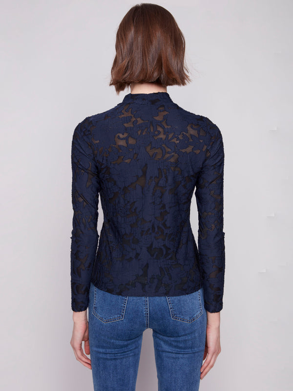 Elegant mesh fabric in this blue black top adds texture and sophistication to any outfit by Charlie B.