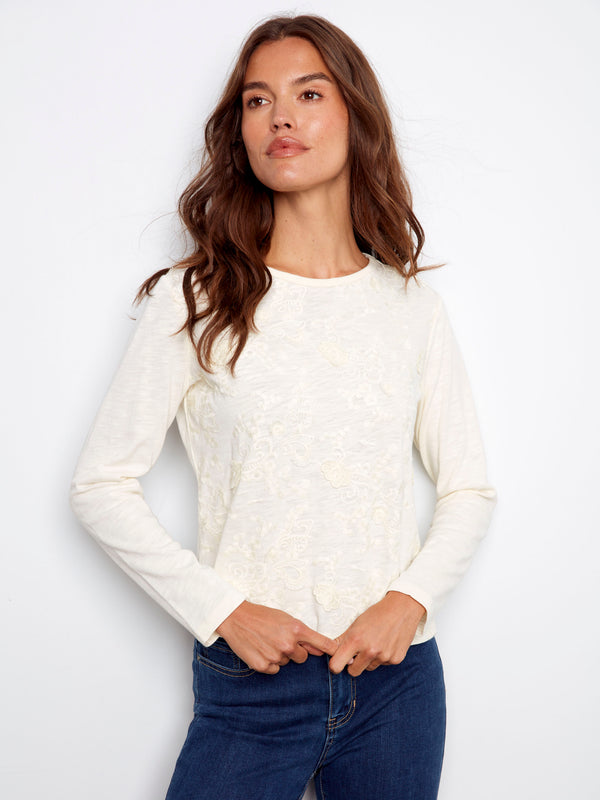 Ecru jersey top with floral embroidery, crafted from 100% cotton for comfort and style by Charlie B.