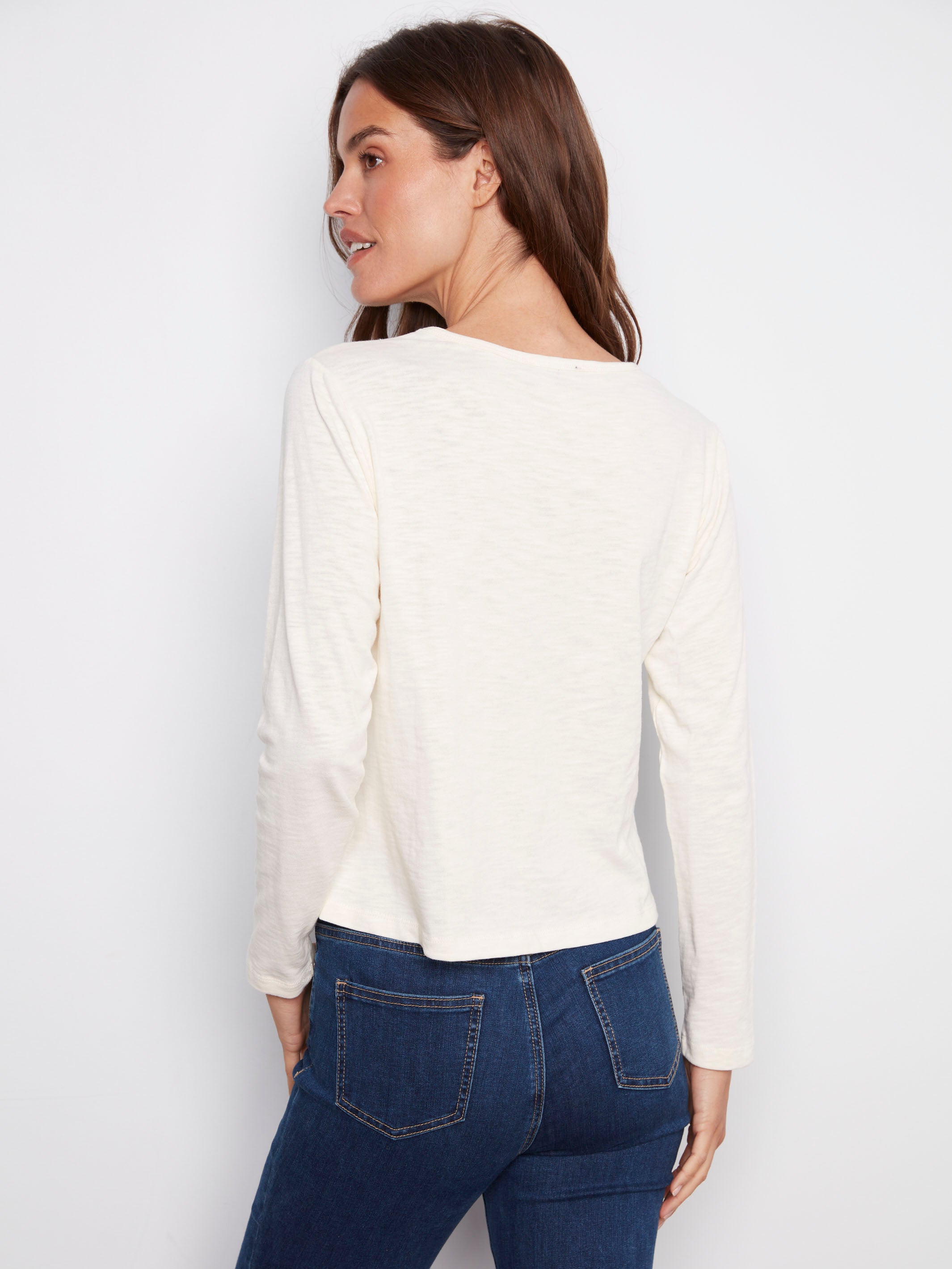 Elegantly embroidered ecru top with long sleeves, perfect for layering in any season by Charlie B.