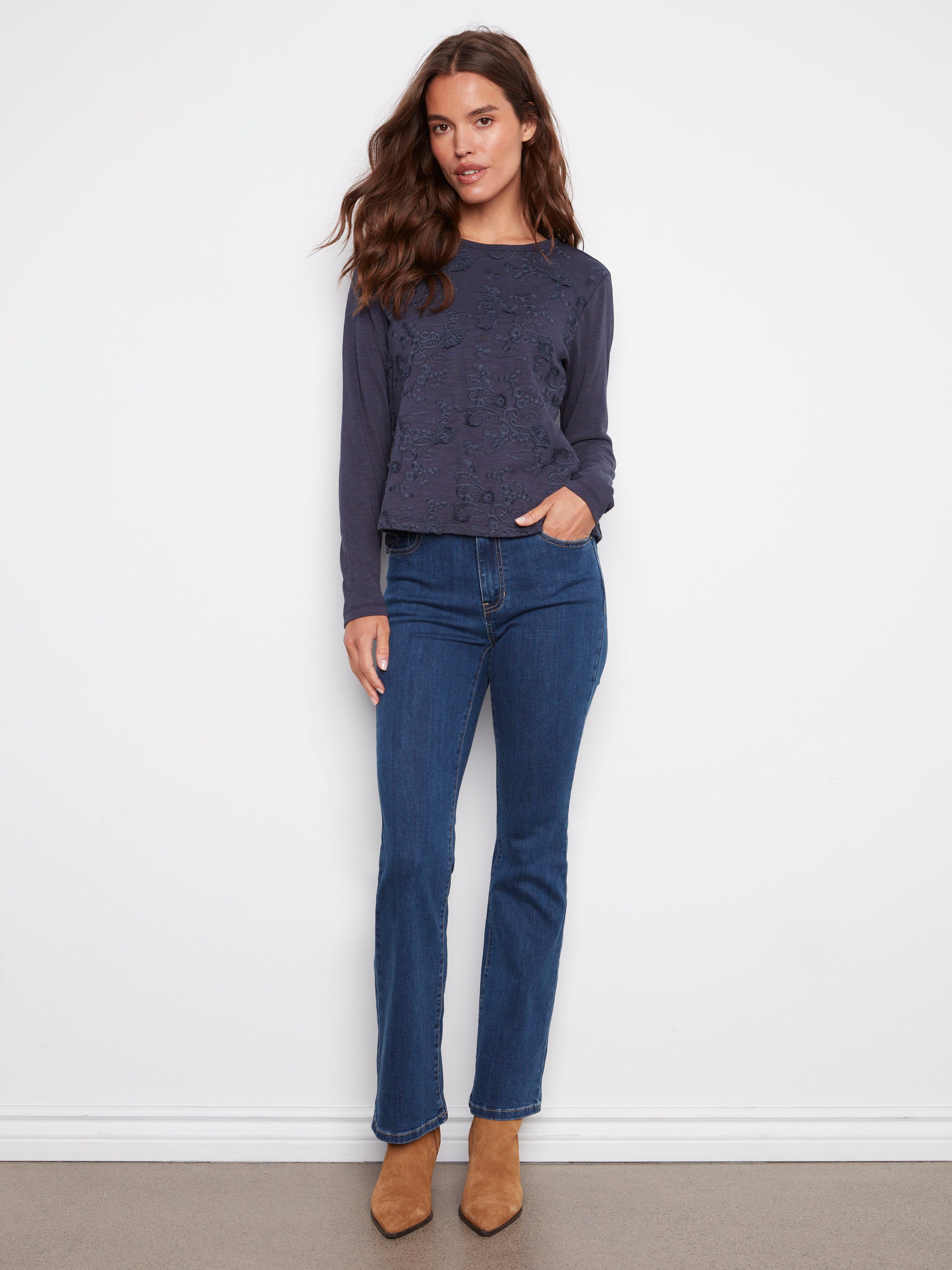 Elegant long-sleeve jersey top made from 100% cotton, showcasing delicate embroidery by Charlie B.
