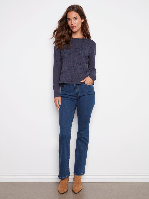 Elegant long-sleeve jersey top made from 100% cotton, showcasing delicate embroidery by Charlie B.