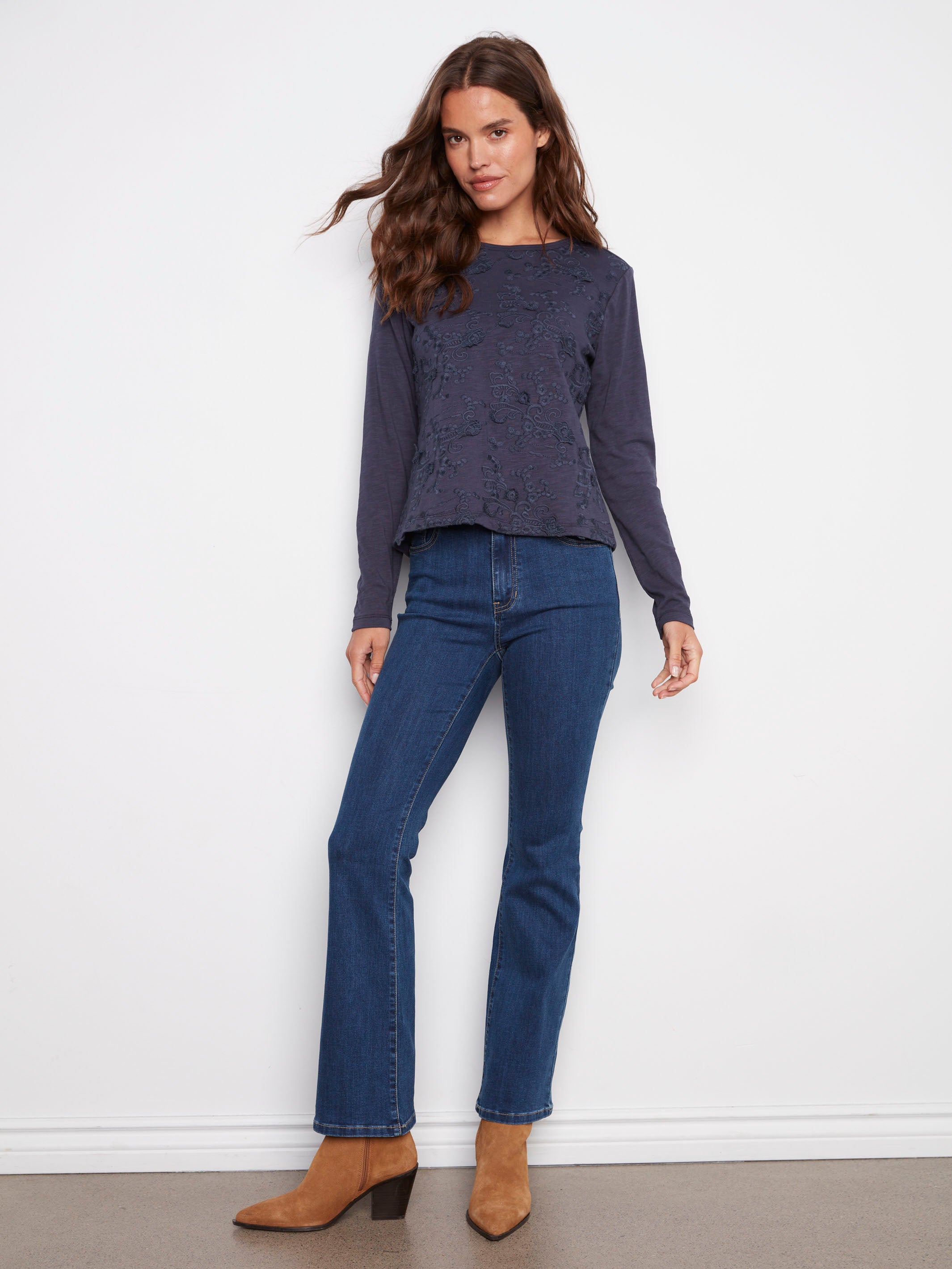 Floral embroidery adds a touch of elegance to this comfortable moonlight jersey top by Charlie B.