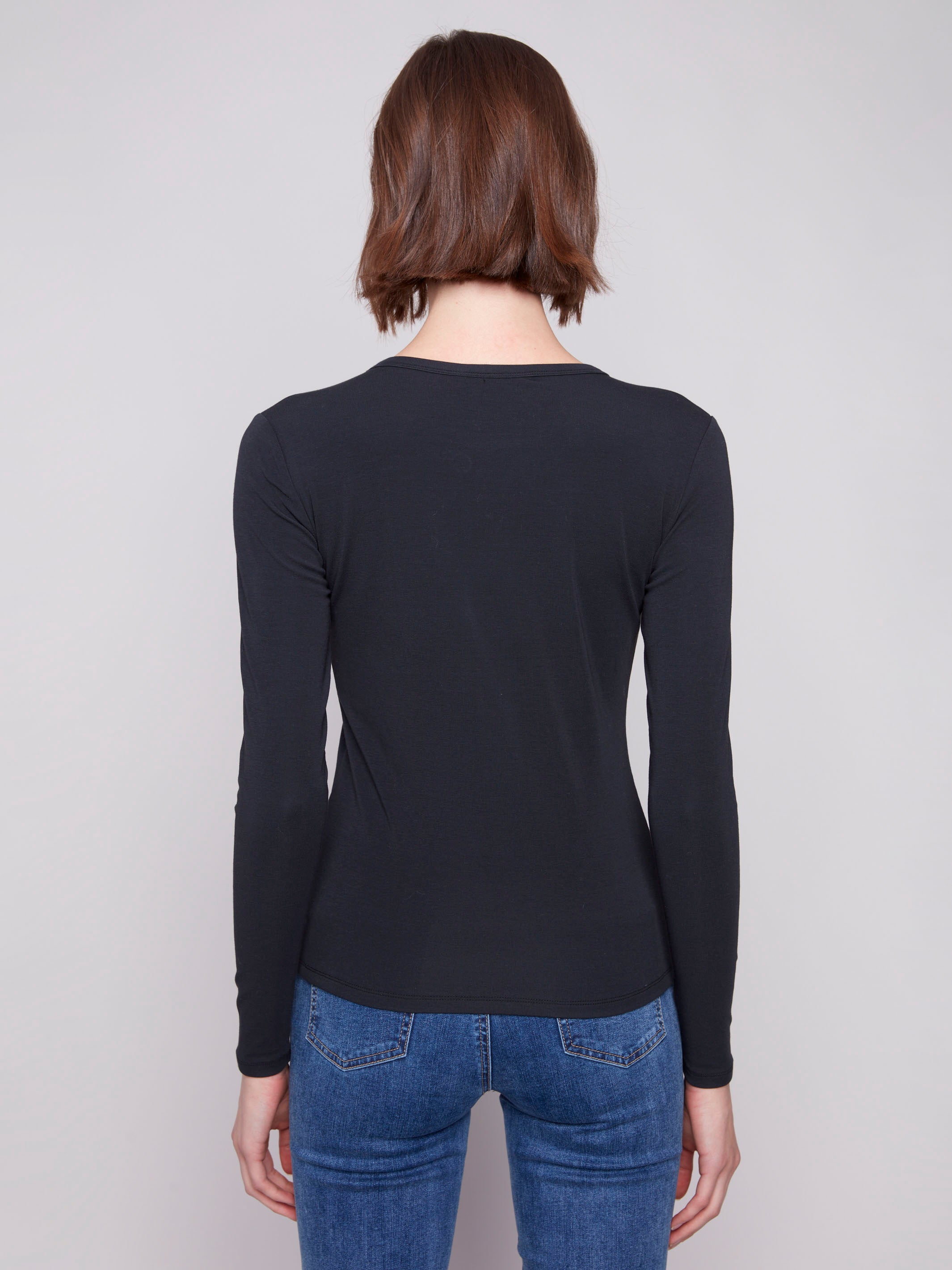 Versatile slim fit knit top in classic black, offering both comfort and style in a cotton blend by Charlie B.