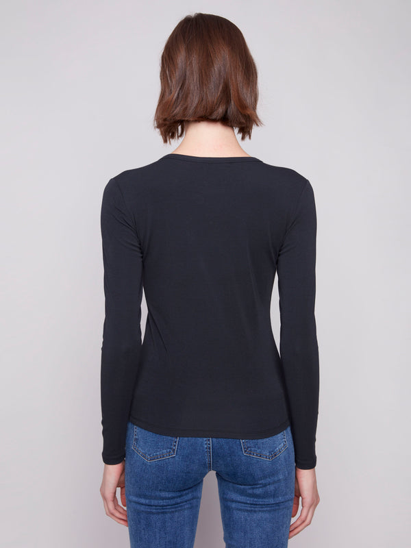 Versatile slim fit knit top in classic black, offering both comfort and style in a cotton blend by Charlie B.