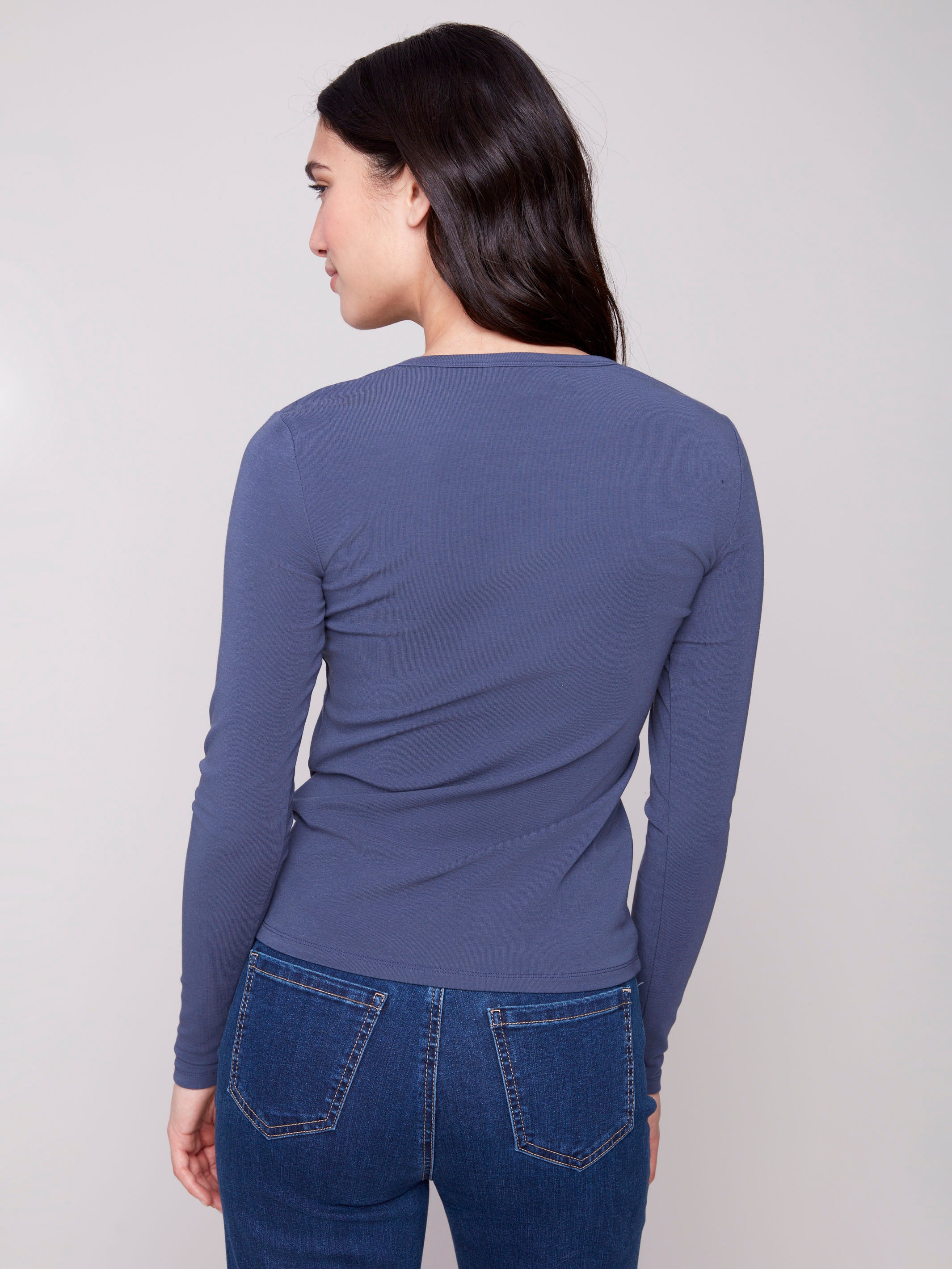 Slim fit denim knit top with long sleeves, ideal for layering or wearing alone by Charlie B.